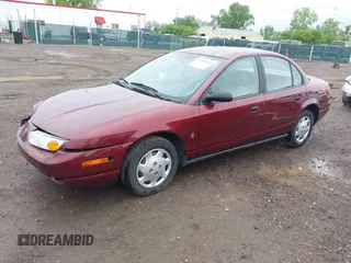 2001 Saturn SL z VIN 1G8ZG52821Z290428, wystawiony jako IAAI lot #42204275 z przebiegiem 171 478 mil mil oraz . Historia ofert i sprzedaży dostępna na DreamBid. Obrazek 2.