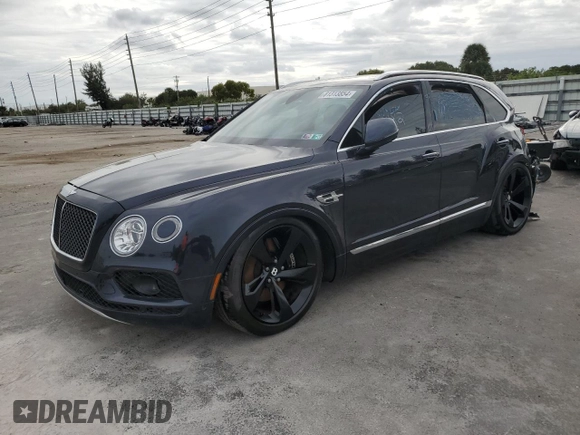 2019 Bentley Bentayga V8 z VIN SJAAM2ZV6KC025300, wystawiony jako Copart lot #81313854 z przebiegiem 2 982 mil mil oraz Szkoda całkowita • Salvage title. Historia ofert i sprzedaży dostępna na DreamBid. Obrazek 1.