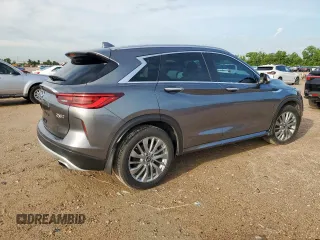 2023 Infiniti QX50 Luxe z VIN 3PCAJ5BA3PF105275, wystawiony jako Copart lot #61144205 z przebiegiem 26 399 mil mil oraz Szkoda całkowita • Salvage title. Historia ofert i sprzedaży dostępna na DreamBid. Obrazek 3.
