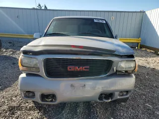 1999 GMC Denali z VIN 1GKEK13R4XR918005, wystawiony jako Copart lot #74964184 z przebiegiem 206 584 mil mil oraz Nie do naprawy. Historia ofert i sprzedaży dostępna na DreamBid. Obrazek 5.