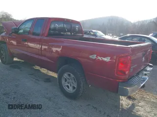 2006 Dodge Dakota SLT with VIN 1D7HW42N16S525329, listed as a IAAI auction lot 40920101 with 124,535 mi miles and . Bid and sale history available at carsss.com. Image 3.
