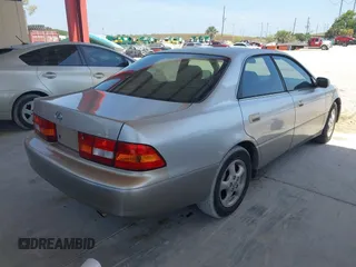 1999 Lexus ES 300 Luxury Sport Sdn with VIN JT8BF28G0X5065317, listed as a IAAI auction lot 42080216 with 163,223 mi miles. Bid and sale history available at carsss.com. Image 4.