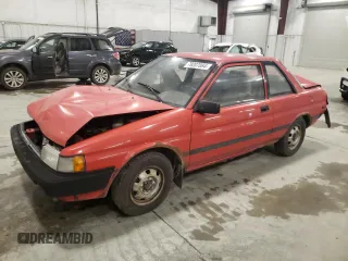 1989 Toyota Tercel z VIN JT2EL31DXK0410350, wystawiony jako Copart lot #79207084 z przebiegiem 189 827 mil mil oraz Szkody całkowita. Historia ofert i sprzedaży dostępna na DreamBid. Obrazek 1.