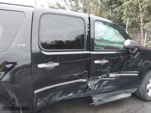 2011 Chevrolet Suburban LTZ with VIN 1GNSCKE02BR206544, listed as a IAAI auction lot 41159341 with 218,202 mi miles. Bid and sale history available at carsss.com. Image 13.