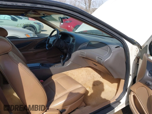 1996 Ford Thunderbird LX z VIN 1FALP6240TH131517, wystawiony jako IAAI lot #41811552 z przebiegiem 87 493 mil mil oraz . Historia ofert i sprzedaży dostępna na DreamBid. Obrazek 5.