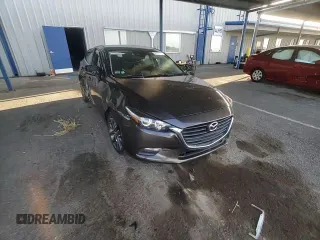 2018 Mazda 3 Touring z VIN 3MZBN1L30JM195471, wystawiony jako Copart lot #57497115 z przebiegiem 147 899 mil mil oraz Szkoda całkowita • Salvage title. Historia ofert i sprzedaży dostępna na DreamBid. Obrazek 13.