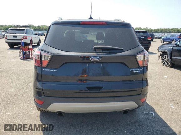 2018 Ford Escape Titanium with VIN 1FMCU9J97JUB94406, listed as a Copart auction lot 66663215 with 96,482 mi miles and Salvage title. Bid and sale history available at DreamBid. Image 6.