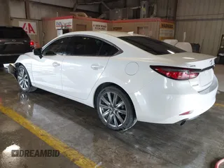 2021 Mazda 6 Carbon Edition with VIN JM1GL1WY9M1614117, listed as a IAAI auction lot 41305576 with 54,670 mi miles and . Bid and sale history available at DreamBid. Image 3.