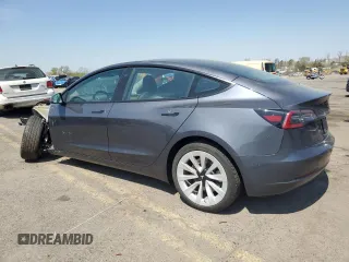 2023 Tesla Model 3 Long Range with VIN 5YJ3E1EB2PF389041, listed as a Copart auction lot 53450725 with 27,060 mi miles and Salvage Title. Bid and sale history available at DreamBid. Image 2.