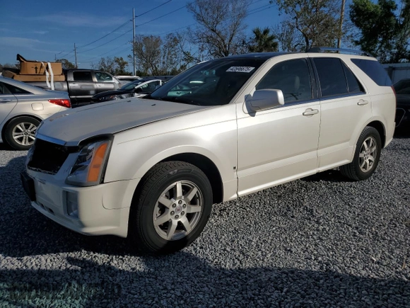 2009 Cadillac SRX RWD z VIN 1GYEE637590113453, wystawiony jako Copart lot #42596675 z przebiegiem 115 118 mil mil oraz Szkoda całkowita • Salvage title. Historia ofert i sprzedaży dostępna na DreamBid. Obrazek 1.