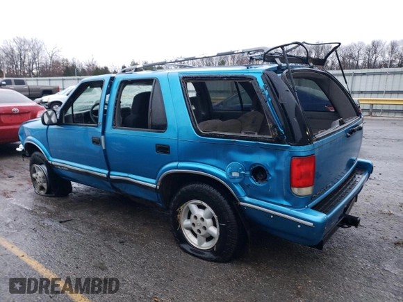 1995 Chevrolet Blazer z VIN 1GNDT13W4S2154787, wystawiony jako Copart lot #85719274 z przebiegiem 167 242 mil mil oraz Nie do naprawy • Non repairable. Historia ofert i sprzedaży dostępna na DreamBid. Obrazek 2.