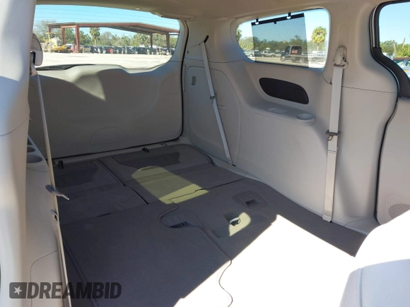2021 Chrysler Pacifica Touring L with VIN 2C4RC1BG3MR560234, listed as a IAAI auction lot 40926673 with 27,830 mi miles and . Bid and sale history available at DreamBid. Image 12.
