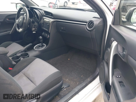 2014 Scion tC with VIN JTKJF5C79E3075707, listed as a IAAI auction lot 41557310 with 132,468 mi miles. Bid and sale history available at carsss.com. Image 5.