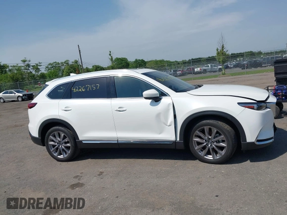 2021 Mazda CX-9 Grand Touring z VIN JM3TCBDY8M0537986, wystawiony jako IAAI lot #42267157 z przebiegiem 25 375 mil mil oraz . Historia ofert i sprzedaży dostępna na DreamBid. Obrazek 14.