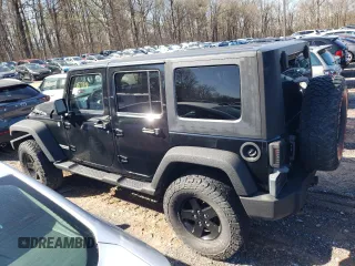 2009 Jeep Wrangler Unlimited Rubicon with VIN 1J8GA69179L756441, listed as a Copart auction lot 52111435 with 157,818 mi miles and Salvage title. Bid and sale history available at DreamBid. Image 2.