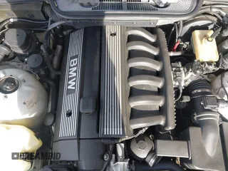 1997 BMW 3-Series 328IC with VIN WBABK8323VET99797, listed as a IAAI auction lot 41616423 with 177,621 mi miles. Bid and sale history available at carsss.com. Image 10.