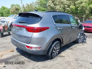 2018 Kia Sportage EX z VIN KNDPNCAC6J7401698, wystawiony jako IAAI lot #42071433 z przebiegiem 88 782 mil mil oraz . Historia ofert i sprzedaży dostępna na DreamBid. Obrazek 4.