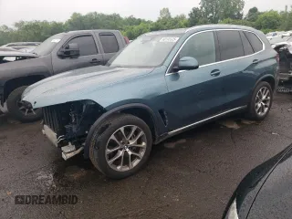 2024 BMW X5 xDrive40i with VIN 5UX23EU02R9T63818, listed as a Copart auction lot 60195525 with 26,773 mi miles and Salvage title. Bid and sale history available at DreamBid. Image 1.