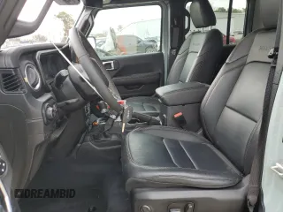 2024 Jeep Wrangler Sahara with VIN 1C4PJXENXRW153777, listed as a Copart auction lot 46066605 with 16,707 mi miles and Salvage Title. Bid and sale history available at DreamBid. Image 7.