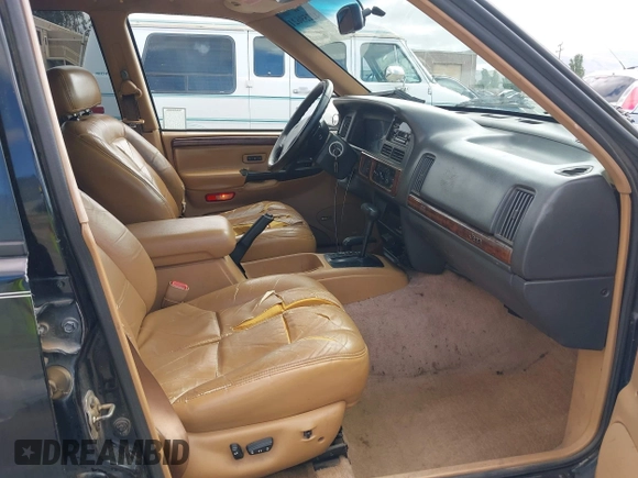 1996 Jeep Grand Cherokee Limited z VIN 1J4GZ78Y3TC191000, wystawiony jako IAAI lot #42259621 z przebiegiem 212 690 mil mil oraz . Historia ofert i sprzedaży dostępna na DreamBid. Obrazek 5.