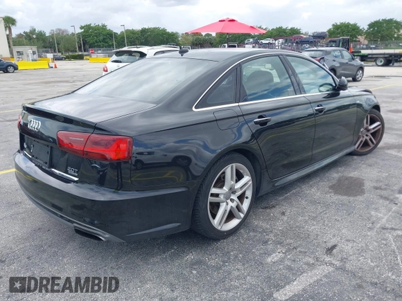 2016 Audi A6 2.0T Premium Plus with VIN WAUGFAFC6GN055826, listed as a IAAI auction lot 42011778 with 98,210 mi miles. Bid and sale history available at carsss.com. Image 4.