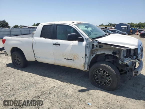 2012 Toyota Tundra with VIN 5TFRM5F14CX039145, listed as a Copart auction lot 56520015 with 129,114 mi miles and Salvage title. Bid and sale history available at DreamBid. Image 4.