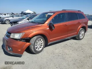 2013 Dodge Journey SXT with VIN 3C4PDCBG1DT659938, listed as a Copart auction lot 64701035 with 194,019 mi miles and Salvage title. Bid and sale history available at DreamBid. Image 1.