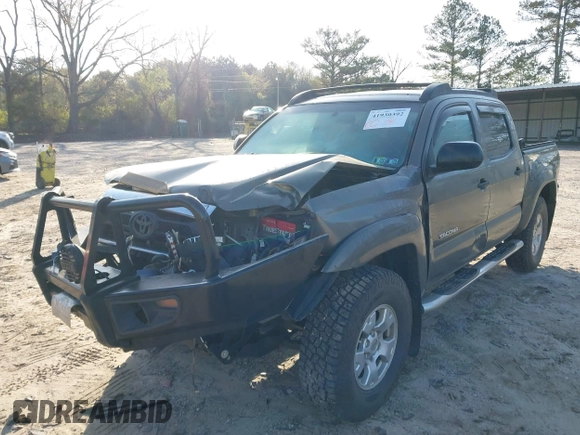 2014 Toyota Tacoma with VIN 3TMLU4EN3EM163162, listed as a IAAI auction lot 41930392 with 167,368 mi miles and . Bid and sale history available at DreamBid. Image 6.