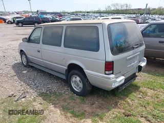 1991 Dodge Grand Caravan with VIN 1B4GK54R6MX632977, listed as a IAAI auction lot 42063934 with 130,812 mi miles and . Bid and sale history available at DreamBid. Image 3.