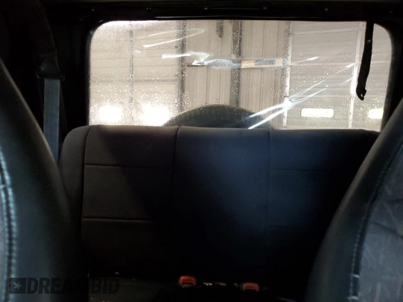 2002 Jeep Wrangler Sport z VIN 1J4FA49S02P730417, wystawiony jako Copart lot #59620865 z przebiegiem Nie podano mil oraz Szkoda całkowita • Salvage title. Historia ofert i sprzedaży dostępna na DreamBid. Obrazek 10.