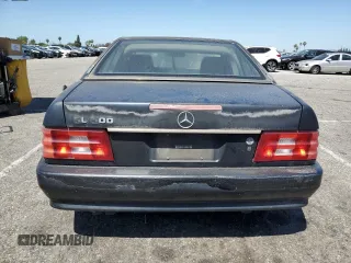 1992 Mercedes-Benz 500 z VIN WDBFA66E9NF050217, wystawiony jako Copart lot #58065965 z przebiegiem 143 456 mil mil oraz Tytuł czysty. Historia ofert i sprzedaży dostępna na DreamBid. Obrazek 6.