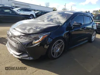 2022 Toyota Corolla Hatchback SE with VIN JTND4MBEXN3180370, listed as a Copart auction lot 74436644 with 57,563 mi miles and Salvage Title. Bid and sale history available at carsss.com. Image 1.
