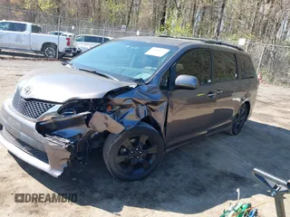 2015 Toyota Sienna SE with VIN 5TDXK3DC3FS682327, listed as a IAAI auction lot 41983156 with 141,640 mi miles. Bid and sale history available at carsss.com. Image 2.