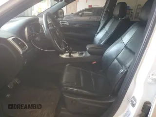 2015 Jeep Grand Cherokee High Altitude with VIN 1C4RJFCG8FC198172, listed as a Copart auction lot 60542165 with 137,313 mi miles and Salvage title. Bid and sale history available at DreamBid. Image 7.