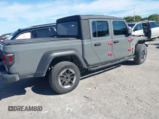 2021 Jeep Gladiator Willys with VIN 1C6HJTAG4ML517715, listed as a IAAI auction lot 41436634 with 21,187 mi miles and . Bid and sale history available at DreamBid. Image 4.