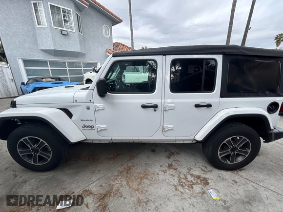 2023 Jeep Wrangler Sahara with VIN 1C4HJXENXPW586579, listed as a IAAI auction lot 41795621 with 34,433 mi miles. Bid and sale history available at carsss.com. Image 14.