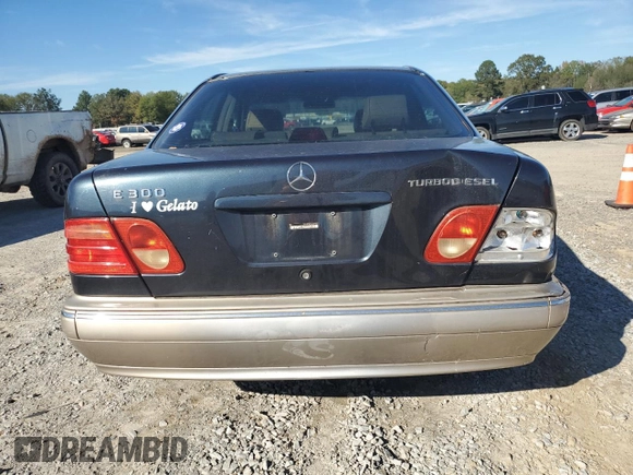 1998 Mercedes-Benz E 320 with VIN WDBJF25F3WA578364, listed as a Copart auction lot 77551834 with 228,913 mi miles and Salvage Title. Bid and sale history available at DreamBid. Image 6.