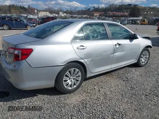 2014 Toyota Camry L with VIN 4T1BF1FK3EU301041, listed as a IAAI auction lot 41858386 with 136,998 mi miles and . Bid and sale history available at DreamBid. Image 4.
