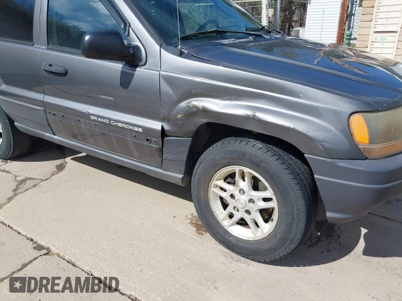 2003 Jeep Grand Cherokee Laredo with VIN 1J4GX48S53C504225, listed as a IAAI auction lot 41879669 with 247,246 mi miles. Bid and sale history available at carsss.com. Image 6.