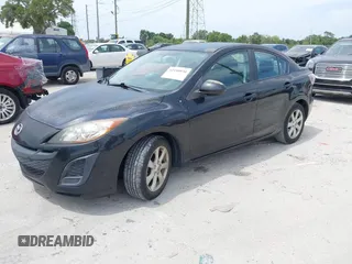2011 Mazda Mazda3 i Touring with VIN JM1BL1VFXB1472772, listed as a IAAI auction lot 42180030 with 128,438 mi miles. Bid and sale history available at carsss.com. Image 2.