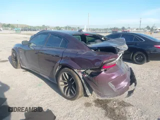2021 Dodge Charger Scat Pack Widebody with VIN 2C3CDXGJXMH559036, listed as a IAAI auction lot 41895328 with 55,017 mi miles and . Bid and sale history available at DreamBid. Image 3.