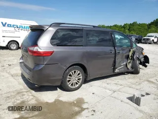 2015 Toyota Sienna XLE with VIN 5TDYK3DC5FS643985, listed as a Copart auction lot 56956505 with 179,131 mi miles and Salvage title. Bid and sale history available at DreamBid. Image 3.