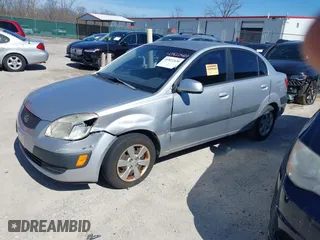 2008 Kia Rio LX with VIN KNADE123X86329097, listed as a IAAI auction lot 41822420 with 180,462 mi miles. Bid and sale history available at carsss.com. Image 2.