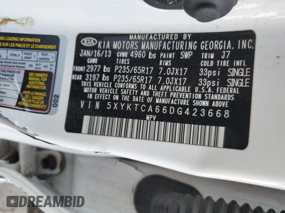 2013 Kia Sorento LX z VIN 5XYKTCA66DG423668, wystawiony jako Copart lot #43718905 z przebiegiem 201 892 mil mil oraz Szkoda całkowita • Salvage title. Historia ofert i sprzedaży dostępna na DreamBid. Obrazek 13.