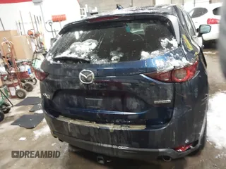 2020 Mazda CX-5 Touring z VIN JM3KFBCM9L0843045, wystawiony jako IAAI lot #41361008 z przebiegiem 76 107 mil mil oraz . Historia ofert i sprzedaży dostępna na DreamBid. Obrazek 16.