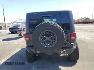 2014 Jeep Wrangler Unlimited Sahara z VIN 1C4BJWEG4EL164226, wystawiony jako Copart lot #53849355 z przebiegiem 82 145 mil mil oraz Szkoda całkowita • Salvage title. Historia ofert i sprzedaży dostępna na DreamBid. Obrazek 6.