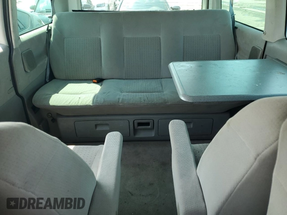 2003 Volkswagen EuroVan MV с VIN WV2MB47033H038192, выставлен на аукционе Copart как лот 67783954 с пробегом 176 595 миль миль и Списание • Salvage title. История ставок и продаж доступна на DreamBid. Изображение 10.
