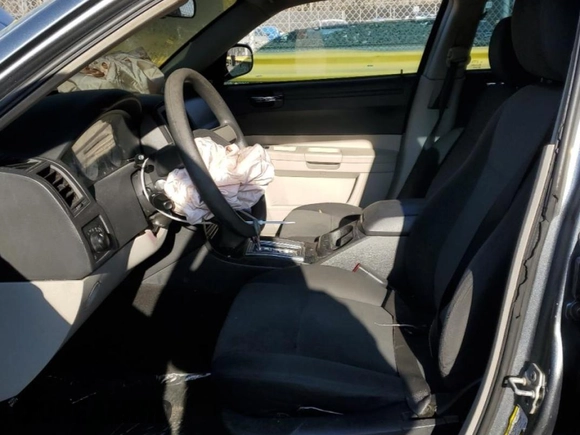 2007 Chrysler 300 with VIN 2C3LA43R37H879094, listed as a Copart auction lot 46334635 with 133,394 mi miles and Salvage Title. Bid and sale history available at DreamBid. Image 7.
