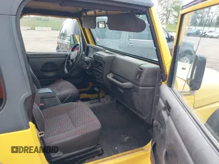 2000 Jeep Wrangler Sport with VIN 1J4FA49S3YP781614, listed as a IAAI auction lot 42292668 with 152,600 mi miles and . Bid and sale history available at DreamBid. Image 5.