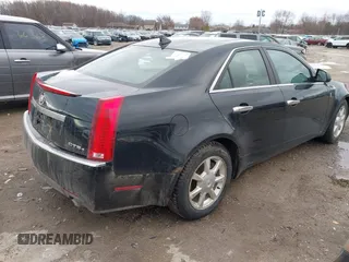 2009 Cadillac CTS AWD z VIN 1G6DG577690116381, wystawiony jako IAAI lot #41944644 z przebiegiem 171 745 mil mil oraz . Historia ofert i sprzedaży dostępna na DreamBid. Obrazek 4.